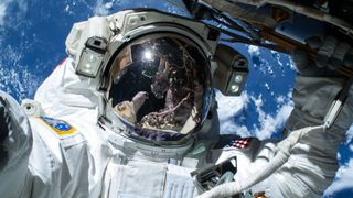 An image of an astronaut in a space suit doing a space walk