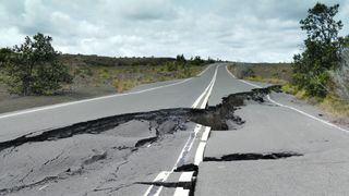 a photo of a road that has been split by an earthquake