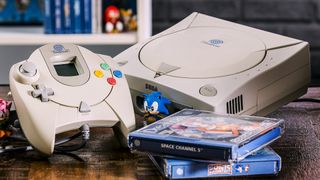  Best Dreamcast games: A picture of a Dreamcast next to two games and a Sonic figure.