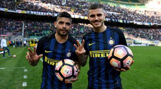 Ever Banega and Mauro Icardi poses with a match ball each after scoring hat-tricks for Inter in a 7-1 win over Atalanta in March 2017.