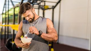 Man eating a vegan meal after exercising at the gym