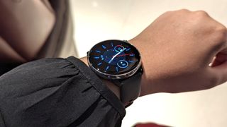 Amazfit GTR Mini smartwatch worn on a wrist, showcasing the basic watch face.