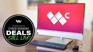 HP EliteOne 870 G9 AIO on a table next to a graphic that says &quot;Cyber Monday Deals Still Live!&quot;