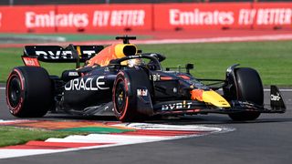 Red Bull Racing&#039;s Dutch driver Max Verstappen takes a turn out on track in his midnight blue F1 car.