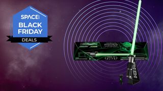 A Star Wars The Black Series Yoda Force FX Elite Electronic Lightsaber, in box and out of box, next to a Space.com Black Friday Deals logo. 