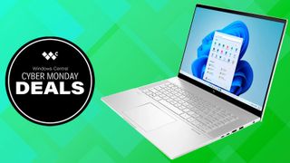 HP Envy on green checkered background with a black circle that reads &quot;Windows Central Cyber Monday Deals&quot;