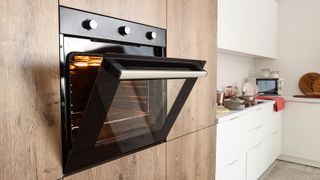 oven open in a wooden kitchen