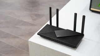 TP- Link Archer AX55 sitting on desk