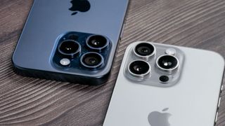 iPhone 16 Pro (silver) and iPhone 15 Pro (blue) compared