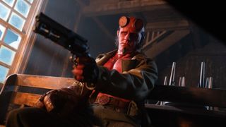 Hellboy pointing his gun.