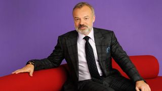 Graham Norton on a red sofa for The Graham Norton Show season 32