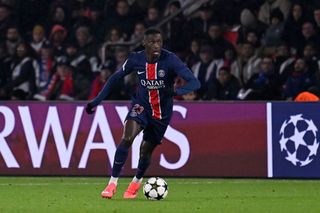 Randal Kolo Muani of Paris Saint-Germain runs with the ball during the UEFA Champions League 2024/25 League Phase MD7 match between Paris Saint-Germain and Atletico Madrid at Parc des Princes on November 06, 2024 in Paris, France.