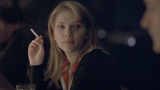  Scarlett Johansson holding a cigarette in Lost in Translation