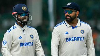 India&#039;s captain Rohit Sharma (R) talks to Rishabh Pant ahead of the