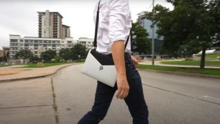 The Laptop Strap on person walking