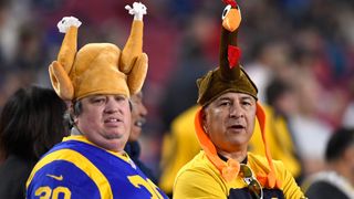 Fans wear turkey hats in honor of Thanksgiving as they attend the game between the Kansas City Chiefs and the Los Angeles Rams 