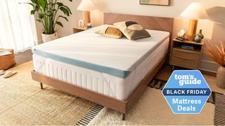 The Tempur-Pedic Tempur-Adapt mattress topper on top of a mattress in a well-lit bedroom