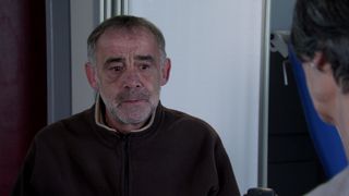 Kevin Webster looks worried as he talks to Dr Gaddas in Coronation Street.