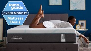 A woman lying on a Tempur-Pedic mattress with a Tom&#039;s Guide Cyber Monday deals label