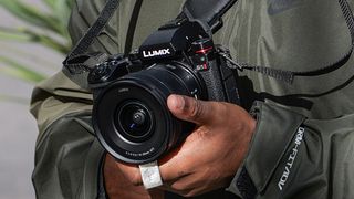 Best camera for filmmaking: Panasonic Lumix S5 II in a photographer&#039;s hands