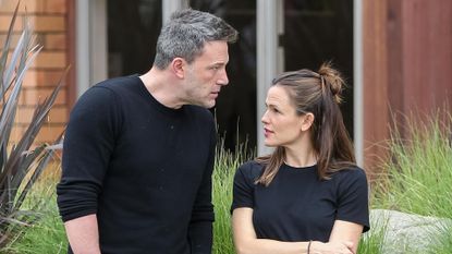 Ben Affleck and Jennifer Garner wearing black shirts and jeans talking in Los Angeles