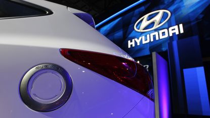 A charging plug is seen on a Hyundai Tucson fuel cell hydrogen-powered EV