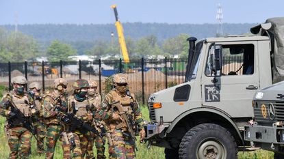 Armed soldiers take part in the search for Jurgen Conings