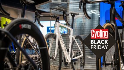 A Van Rysel bike on a stand in a shop with Black Friday roundel