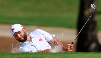 Jon Rahm hits a bunker shot