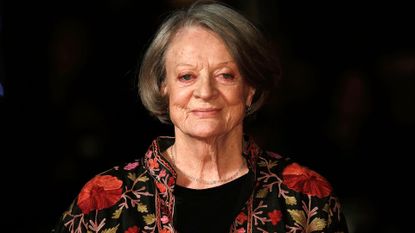 Maggie Smith smiling at a film premiere