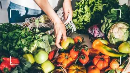 Woman unpacking foods high in vitamin C on counter, including tomatoes and green vegetables