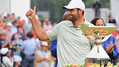 Scottie Scheffler with the FedEx Cup 