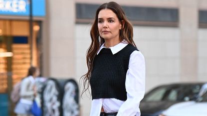 Katie Holmes in a layered top with a leather skirt