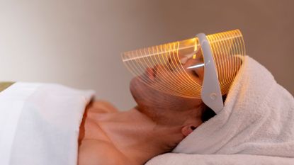 a woman wearing one of the best led face masks