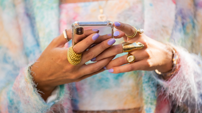 A guest is seen with phone jewelery outside Fendi during the Milan Women&#039;s Fashion Week on September 23, 2020 in Milan, Italy. 