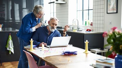 A senior couple looks at a map.