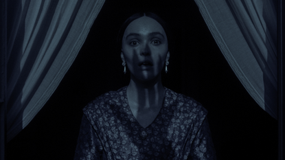 lily rose depp as ellen while she gasps as the shadow of a monster&#039;s hand covers her face in nosferatu