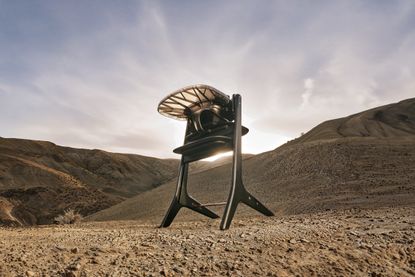 a modern high chair on a desert background