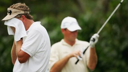 Colin Montgomerie wipes away sweat from his face