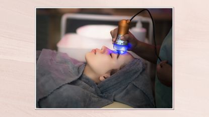 Image of woman receiving laser therapy in a white frame against a dusky pink watercolour background