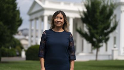 Julie Chavez Rodriguez stands in front of the White House