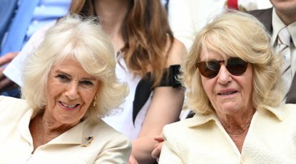 Queen Camilla and her sister, Annabel Elliot, both have coifed blonde hair as they watch Wimbledon in 2024