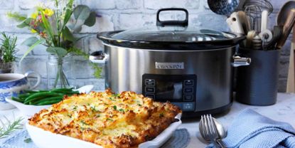 Image of CrockPot slow cooker in promo image on countertop with lamb ragu pie 