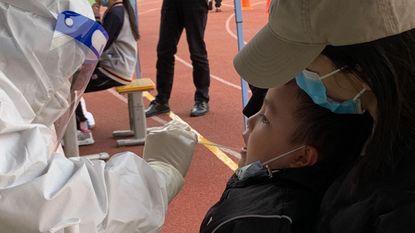 A child is tested for Covid-19 in Lanzhou, China