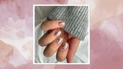 Image of hand with gold leaf nails on a pink watercolour background