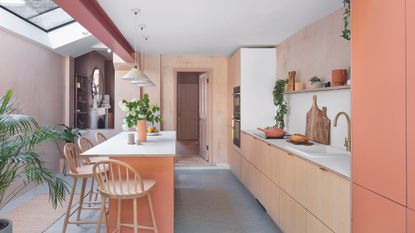 Plywood and orange kitchen