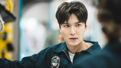 Lee Min-ho, wearing a uniform as he stands in a space station, in &#039;Where the Stars Gossip.&#039;