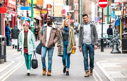 Four students are shopping together at Brick Lane in London.