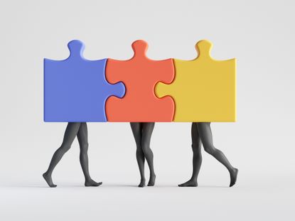 Three colorful puzzle pieces with mannequin legs attached together