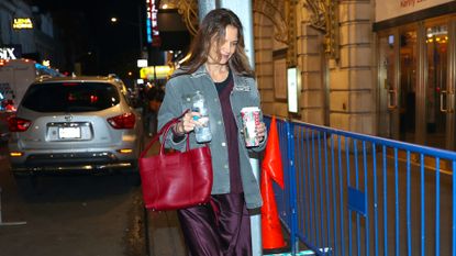 Katie Holmes carrying a red Tod&#039;s bag inspired by Princess Diana